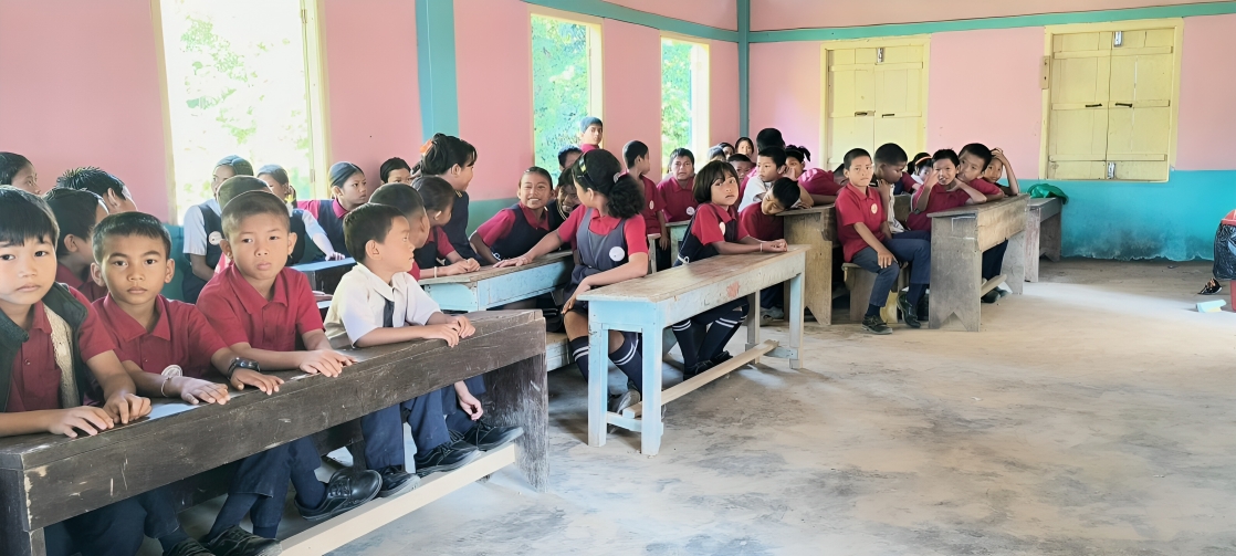 Underprivileged students learning native Chakma script in Sajek school class